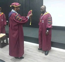 Dressing a Doctoral Graduating Student
